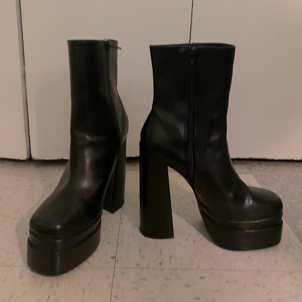 High heeled black leather boots